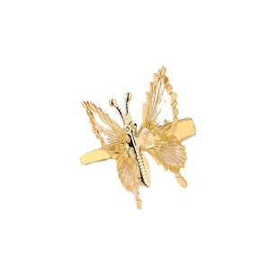 Elegantes pinzas para el cabello de mariposa dorada con alas de metal sobre blanco