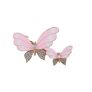 Elegant set of two gold butterfly hair clips with pink oil drip and sparkling rhinestones