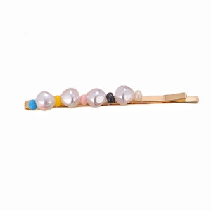 Detailed view of gold alloy hair clip with colorful beads and irregular faux pearls