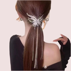 Silver butterfly hair stick with long tassels and rhinestones worn on hair