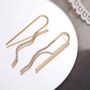 Élégantes boucles d'oreilles longues à pampilles en U dorées avec strass étincelants