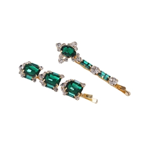 Set di fermagli eleganti con cristalli verde smeraldo, base dorata e strass luminosi