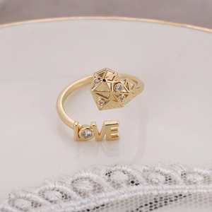 Gold-plated adjustable ring featuring a heart motif, LOVE lettering, and sparkling cubic zirconia