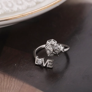 Silver adjustable heart ring with LOVE lettering and shimmering cubic zirconia stones
