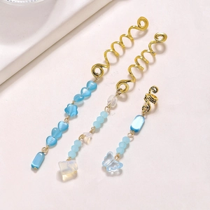 Three-piece gold snake spiral hair rings set with light blue crystal heart pendants