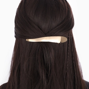 French style gold curved metal hair clip for ponytail styling on dark hair