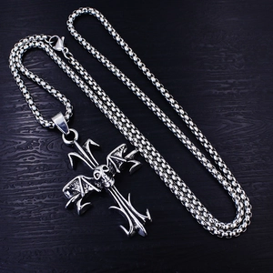 Gothic stainless steel cross necklace featuring central skull and bat wing design