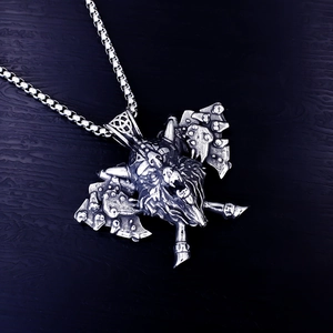 Macro detail of Viking axe and wolf head pendant with antique silver steel finish