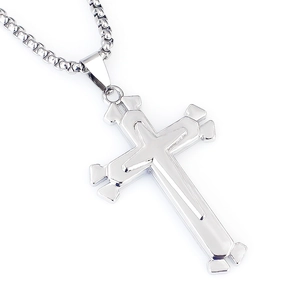 Detail of layered stainless steel cross pendant with high-polished silver finish on box chain