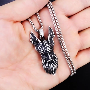 Detail view of a vintage silver Viking warrior pendant on a stainless steel chain