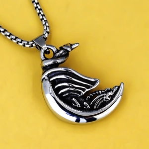 Vintage stainless steel moon dragon pendant necklace with box chain on yellow background