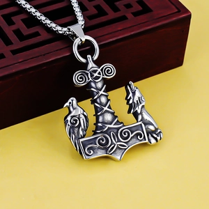 Close-up of Viking anchor pendant with wolf and raven motifs in vintage steel finish