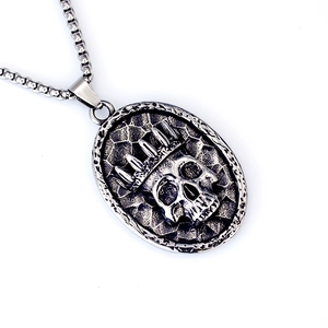 Vintage stainless steel crown skull pendant on a box chain with punk style finish