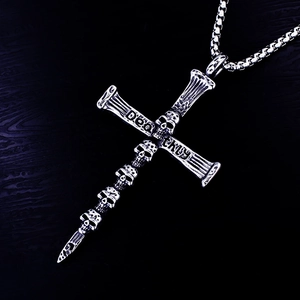 Gothic punk cross pendant necklace with deathly engraved skulls on a vintage chain