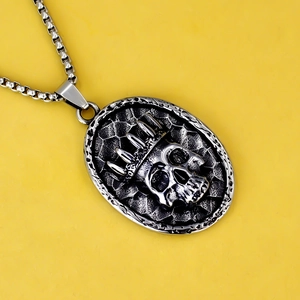 Vintage stainless steel crown skull pendant necklace with dark oxidised finish on box chain