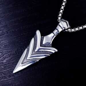 Detailed macro view of the vintage viking arrow pendant with a polished silver finish