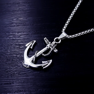 Vintage stainless steel anchor pendant necklace for men with a box chain on wood