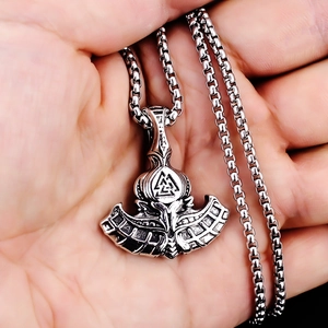 Detailed shot of retro stainless steel Mjölnir pendant necklace with Valknut symbol