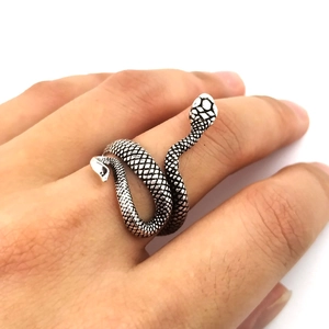 Vintage silver snake-shaped wrap ring with intricate scale texture on model hand