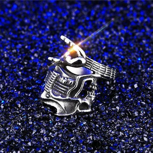 Punk style silver guitar ring with industrial mechanical details and polished finish