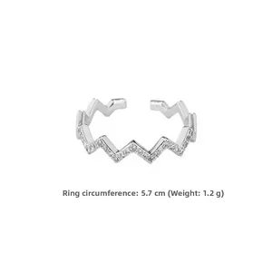 Macro detail of wave shaped adjustable ring with zircon stones measuring 5.7cm in perimeter