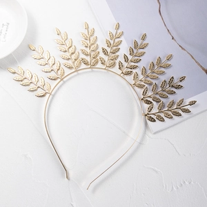 Detailed view of a golden laurel leaf bridal headband with textured metal finish