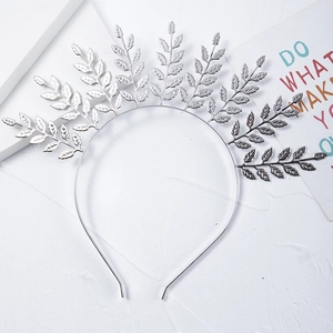Detailed close-up of a silver leaf branch bridal headband in a Greek goddess style design