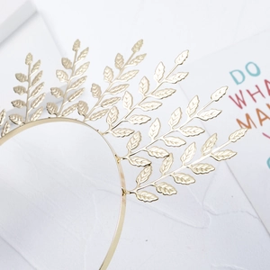 Detailed view of the golden laurel leaf bridal headband with metallic vein textures