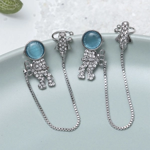 Astronaut and rocket ear cuff earrings with blue cat-eye stones and silver chain