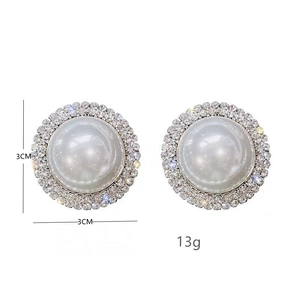 Luxury oversized circular pearl stud earrings with sparkling rhinestone halo and silver base
