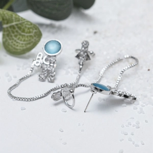 Astronaut earring and ear cuff set with blue opal and chain in silver tone