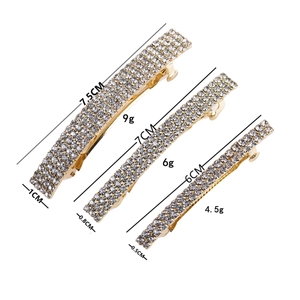 Three sizes of sparkling rhinestone hair clips in gold finish with precise measurements