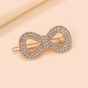 Barrette à cheveux symbole infini doré ornée de strass brillants micro-pave