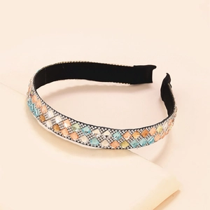 Sparkling crystal headband with colorful rhinestones on elegant geometric pedestal