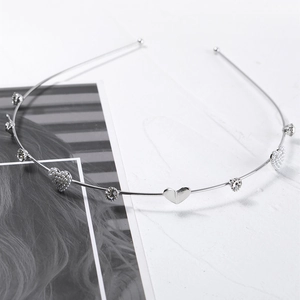 Elegant silver metal headband with polished hearts, faux pearls, and sparkling rhinestones