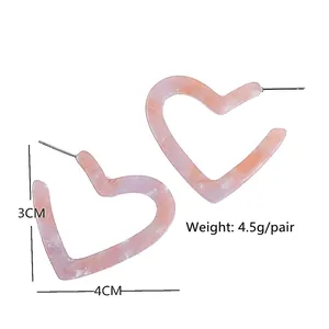 Pink heart-shaped resin hoop earrings with stylish marble pattern and 4cm width