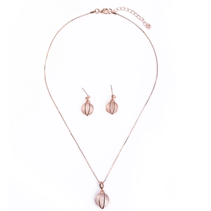 Minimalist bridal jewelry set with rose gold necklace and pink cat eye stone earrings