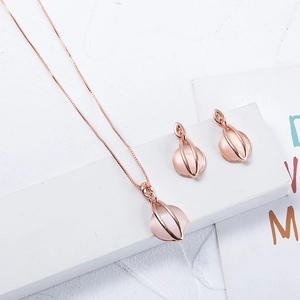 Elegant rose gold jewelry set with pink cat eye stone necklace and matching earrings