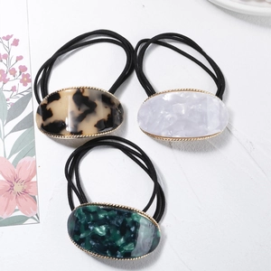 Three-piece hair ties set with oval marble and leopard acetate patterns and gold trim