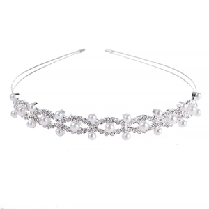 Elegant bridal headband with white pearls and sparkling rhinestones in wavy silver metal