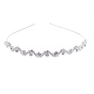 Elegant bridal silver wavy headband with rhinestones and pearls on white background