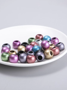 Macro view of colorful mixed barrel beads with metallic finish for hair DIY jewelry making