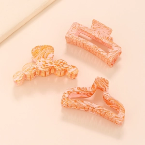 Lot de trois pinces à cheveux géométriques avec texture marbrée orange et blanc