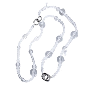 Minimalist pearl necklace with transparent beads and silver metal clasps on white background