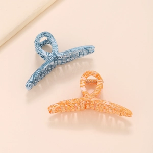 Grandes pinces à cheveux à motif marbré en bleu et orange pour une coiffure élégante