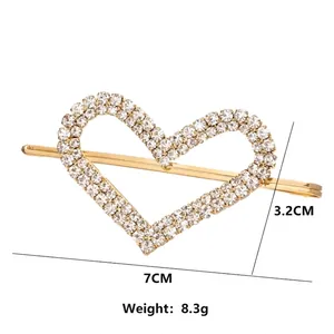 Modieuze gouden hartvormige haarklem met strass-steentjes, 7 cm lang en 3,2 cm hoog