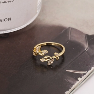 Elegant gold leaf-shaped open ring with sparkling zircon stones in an olive branch design