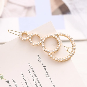 Elegante fermaglio dorato per capelli con perle bianche e design geometrico minimalista