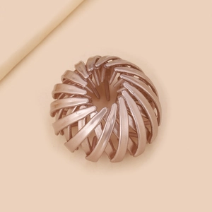 Elegant rose gold bird nest hair claw with expandable spiral structure for bun styling
