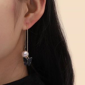 Elegant gold threader earrings with black matte butterfly and white pearl accents for women